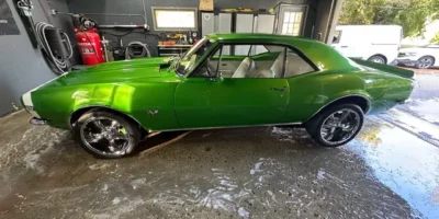 Bright green classic muscle car after complete exterior detailing and paint enhancement.
